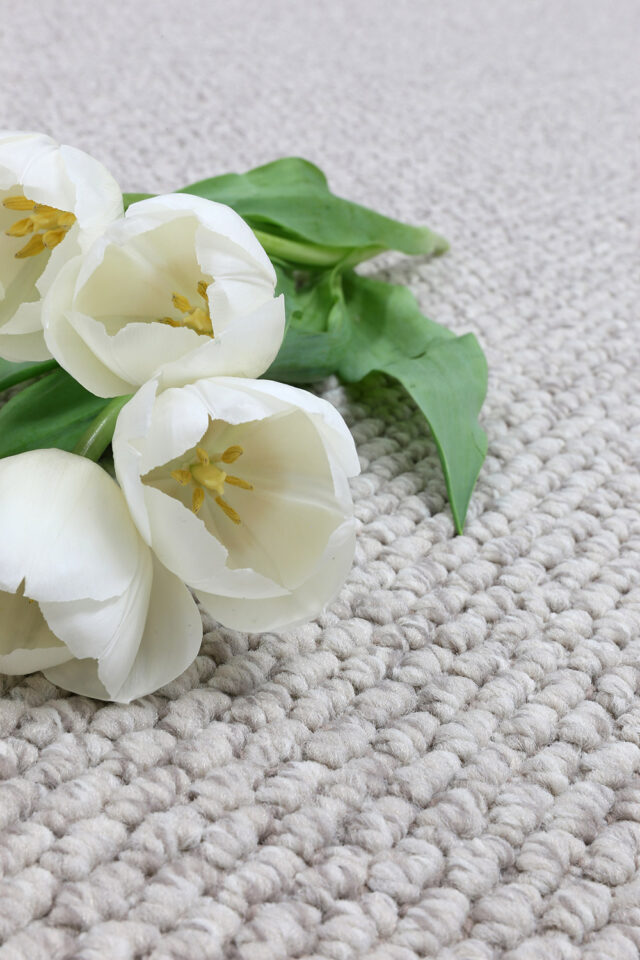 Carpet Buying Guide: How To Choose The Right Carpet 1 Textured carpet in a neutral tone shown in a styled room