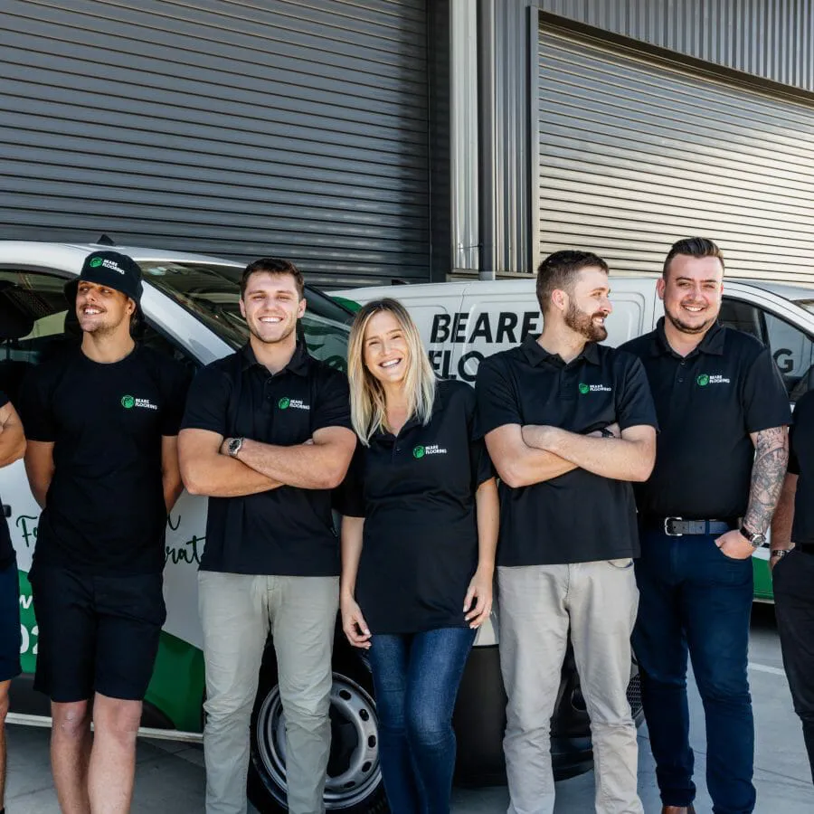 Beare Flooring team standing outside showroom van.