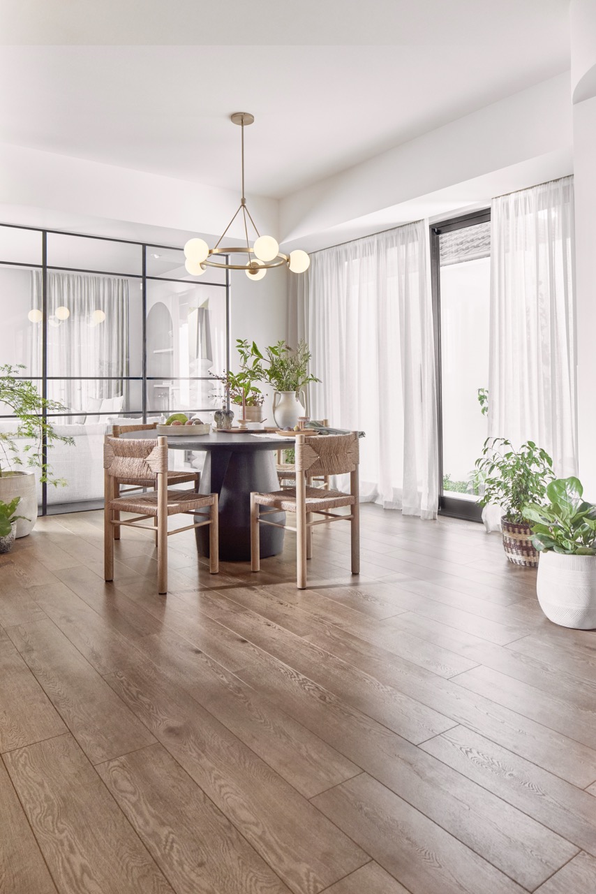 Warm oak timber flooring in modern dining area available now from Beare Flooring.