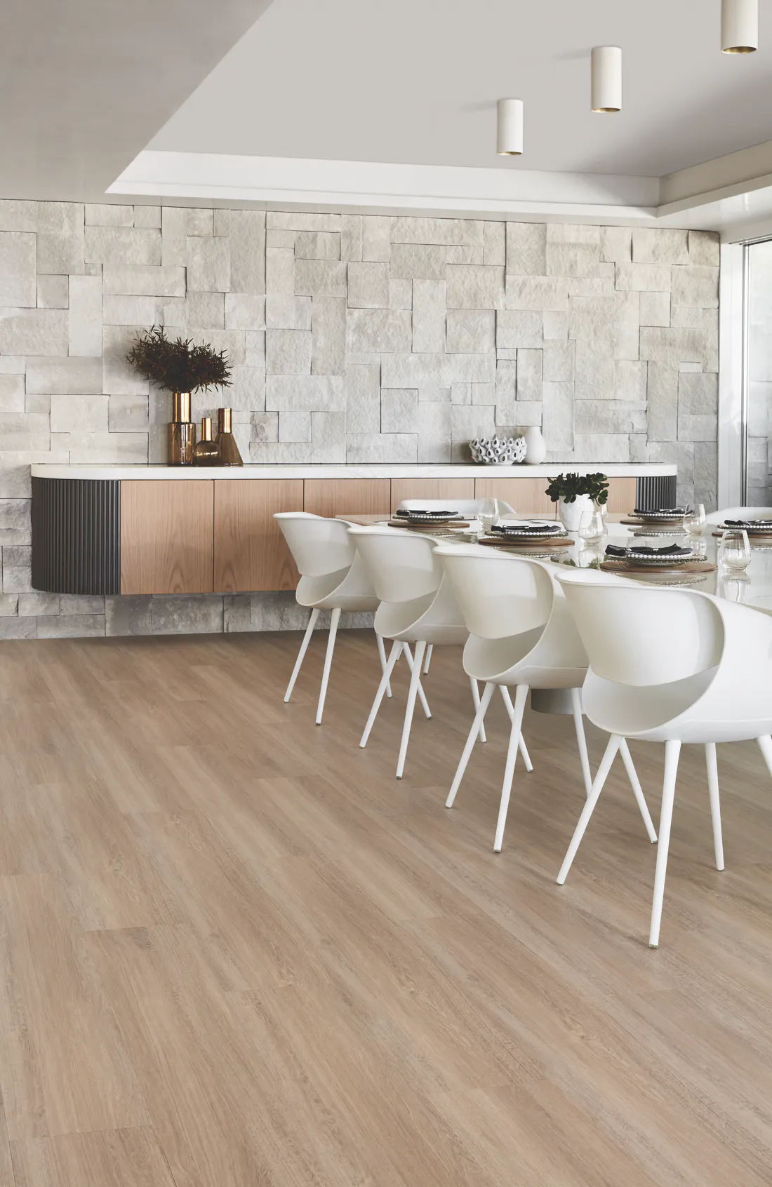 Light oak laminate flooring in modern dining area available now from Beare Flooring.