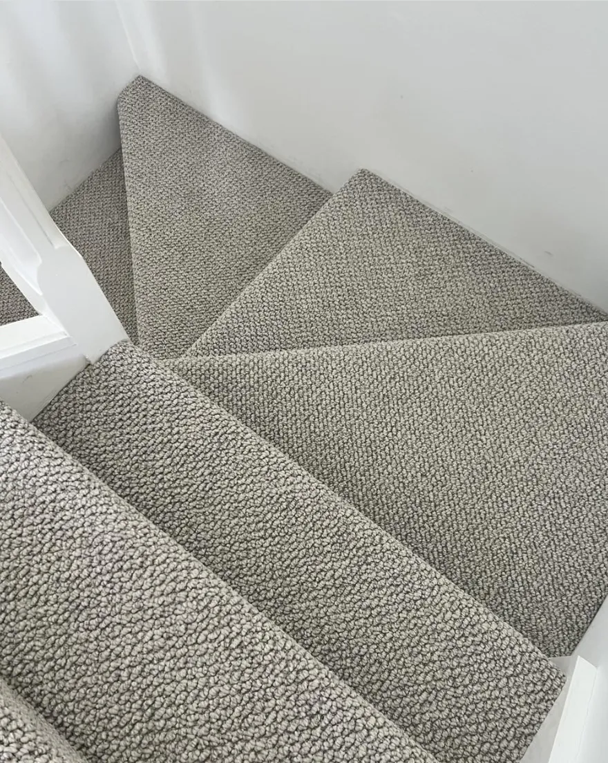 Grey loop pile carpet on stairs available now from Beare Flooring.