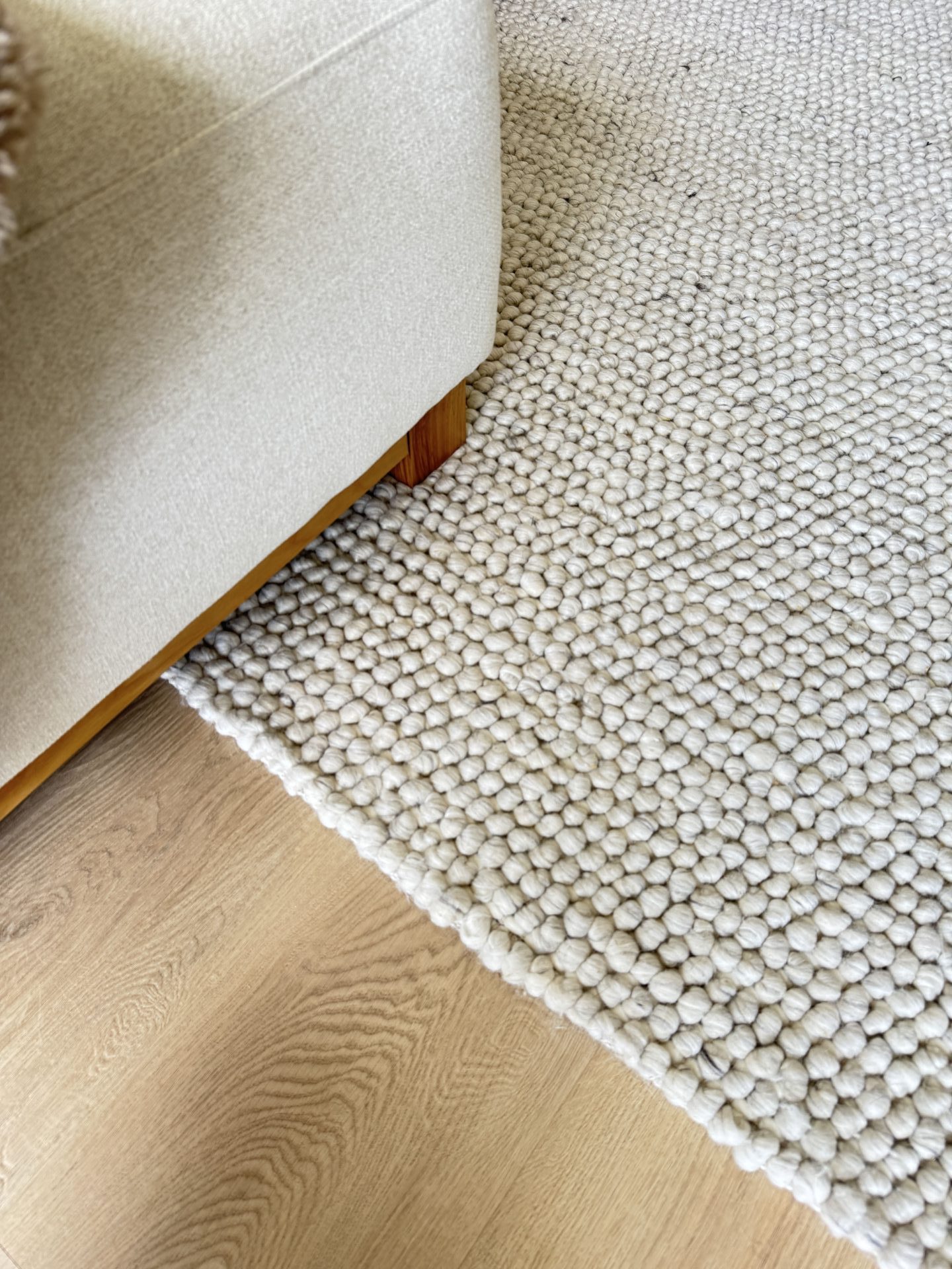 Beige textured carpet with light oak timber flooring available now from Beare Flooring.